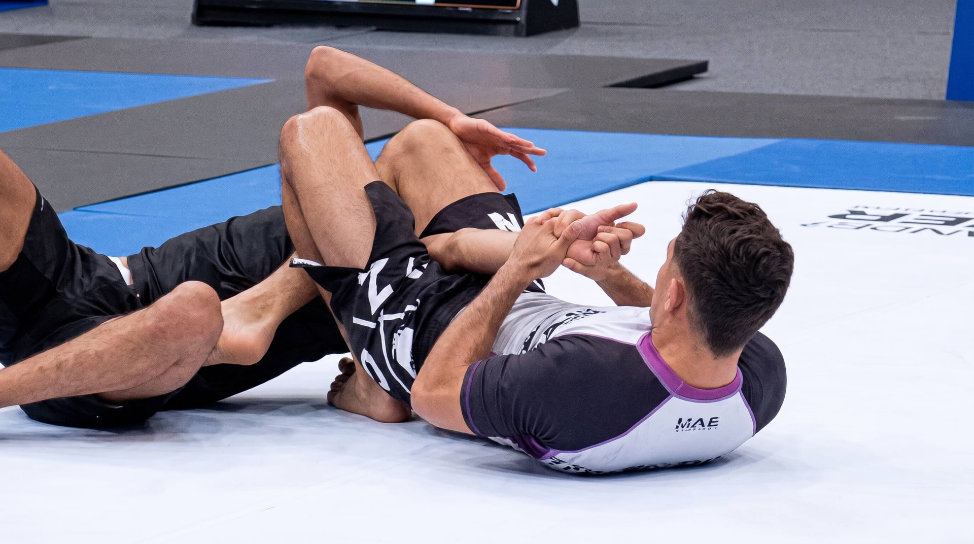 Alexandre Duarte applying an armbar in competition